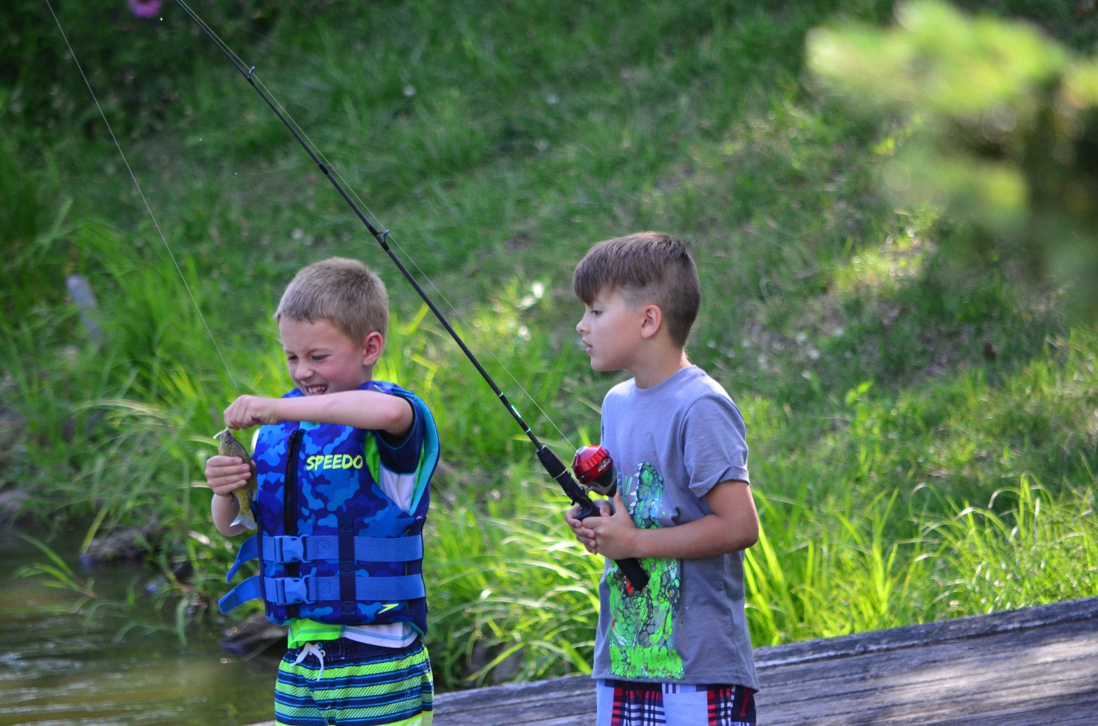 Tyler taking Jerry's fish of the hook