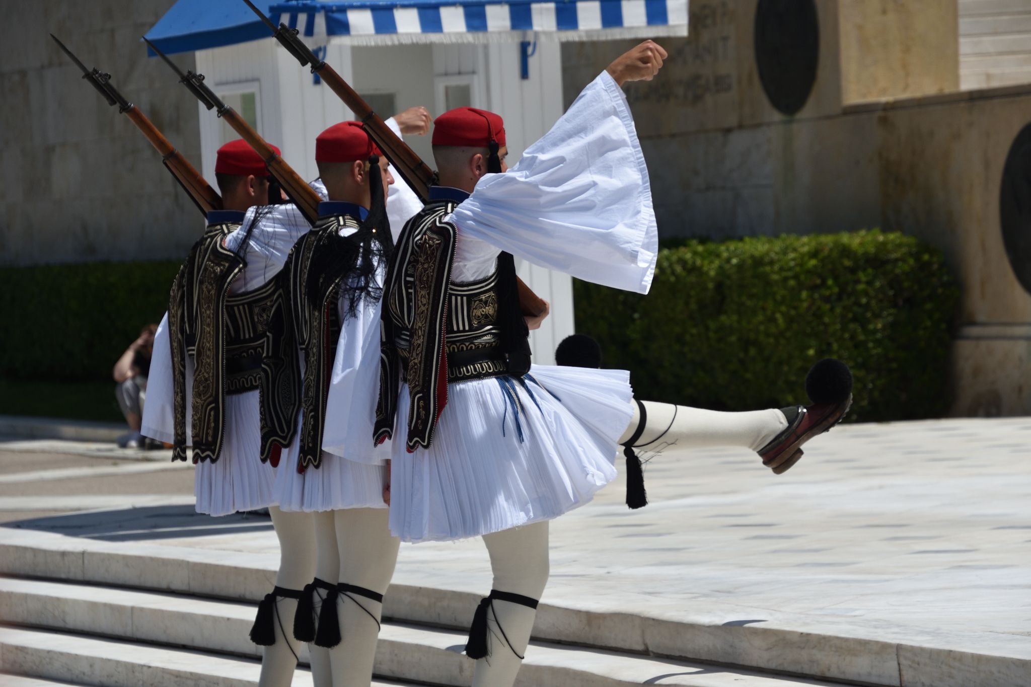 Greek national guards (Evzones) in front of the Tomb of the Unknown Soldier near building of Parliament